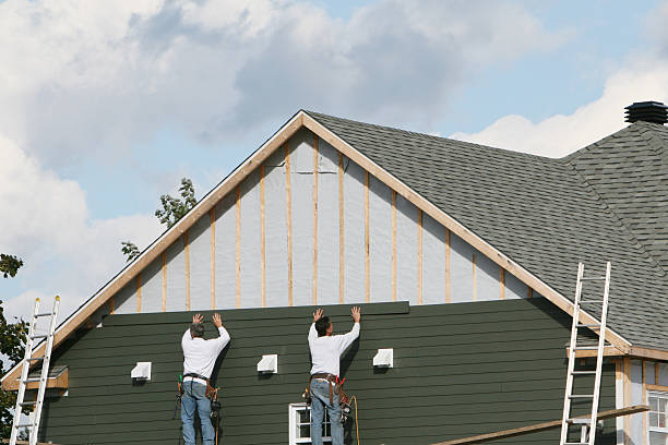 Professional Storm Damage Siding Repair technician working in Medinah, IL
